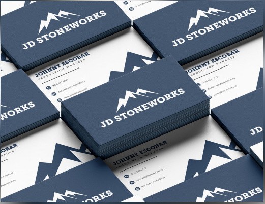 A stack of professional business cards featuring the JD Stoneworks logo and contact details.